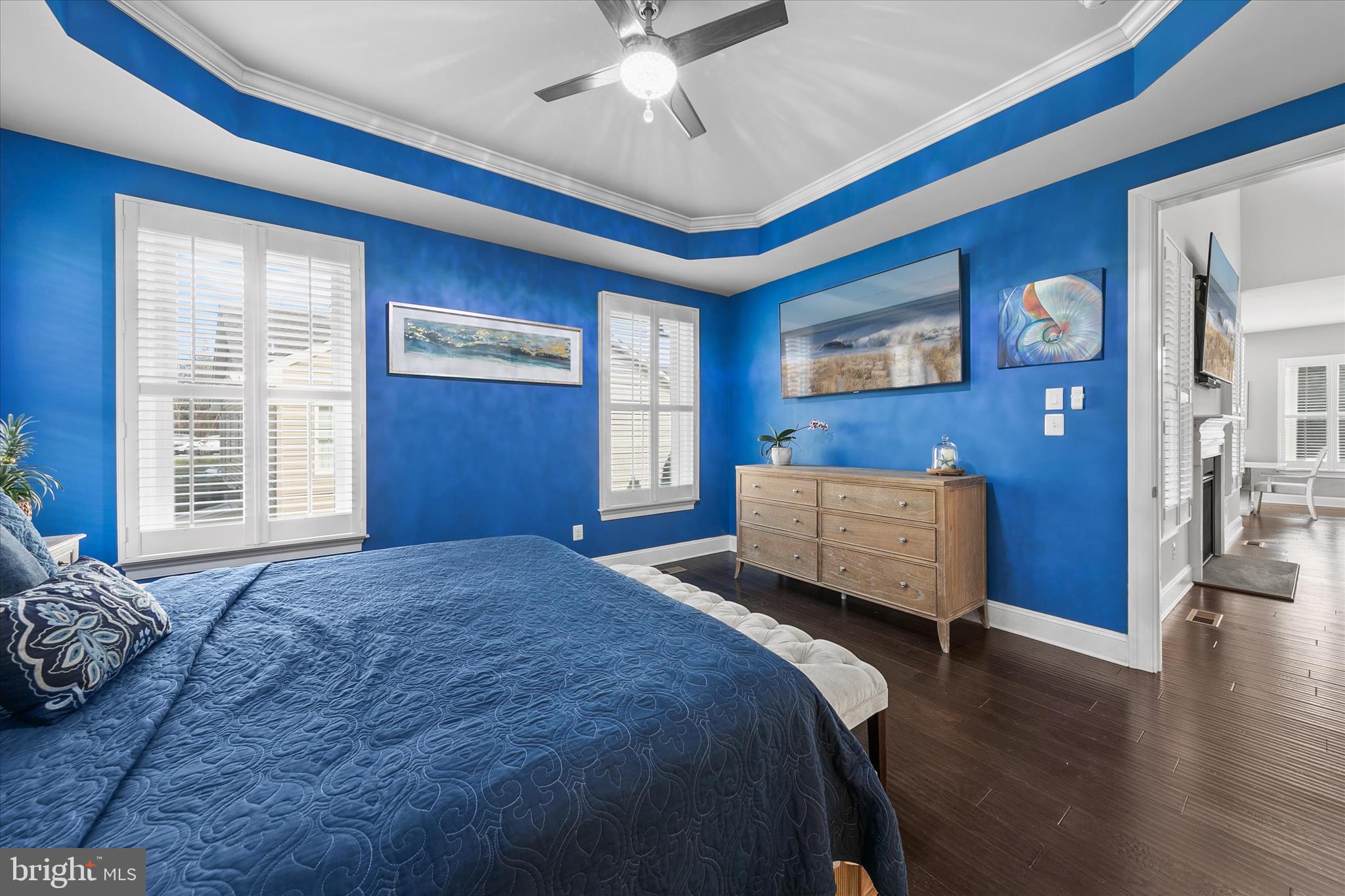 34749 Timber Court Dagsboro, DE 19939 - Photo 22 of 60 a bedroom with a bed and a chandelier