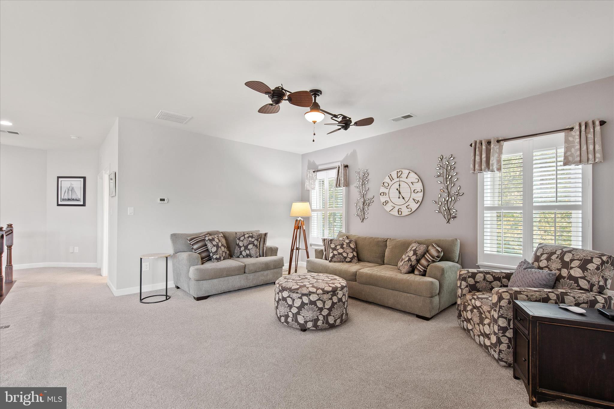 34749 Timber Court Dagsboro, DE 19939 - Photo 32 of 60 a living room with furniture and a large window
