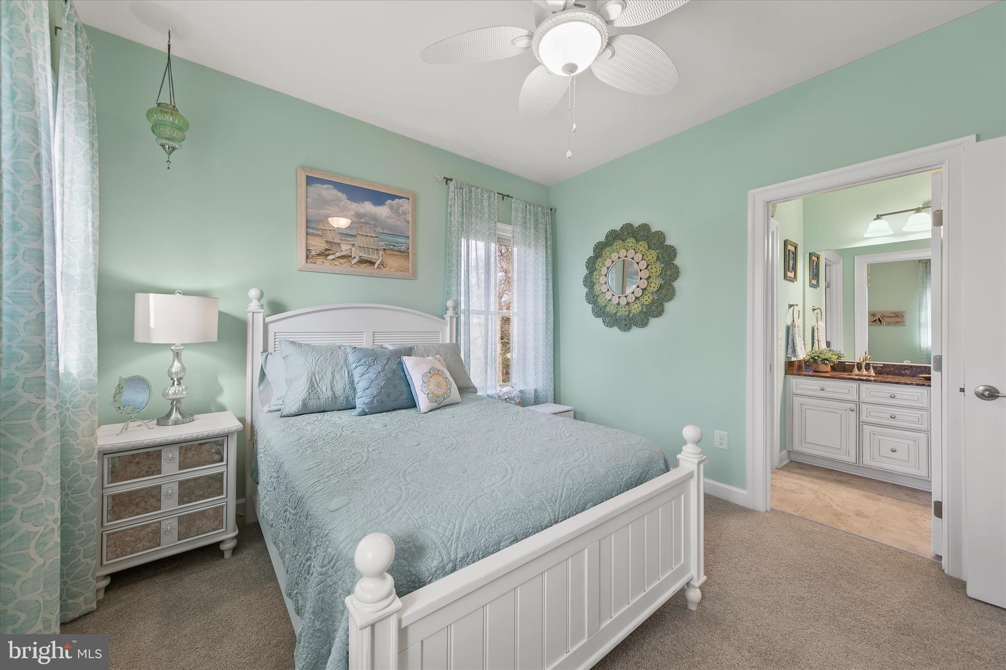 34749 Timber Court Dagsboro, DE 19939 - Photo 38 of 60 a bedroom with a bed and a chandelier