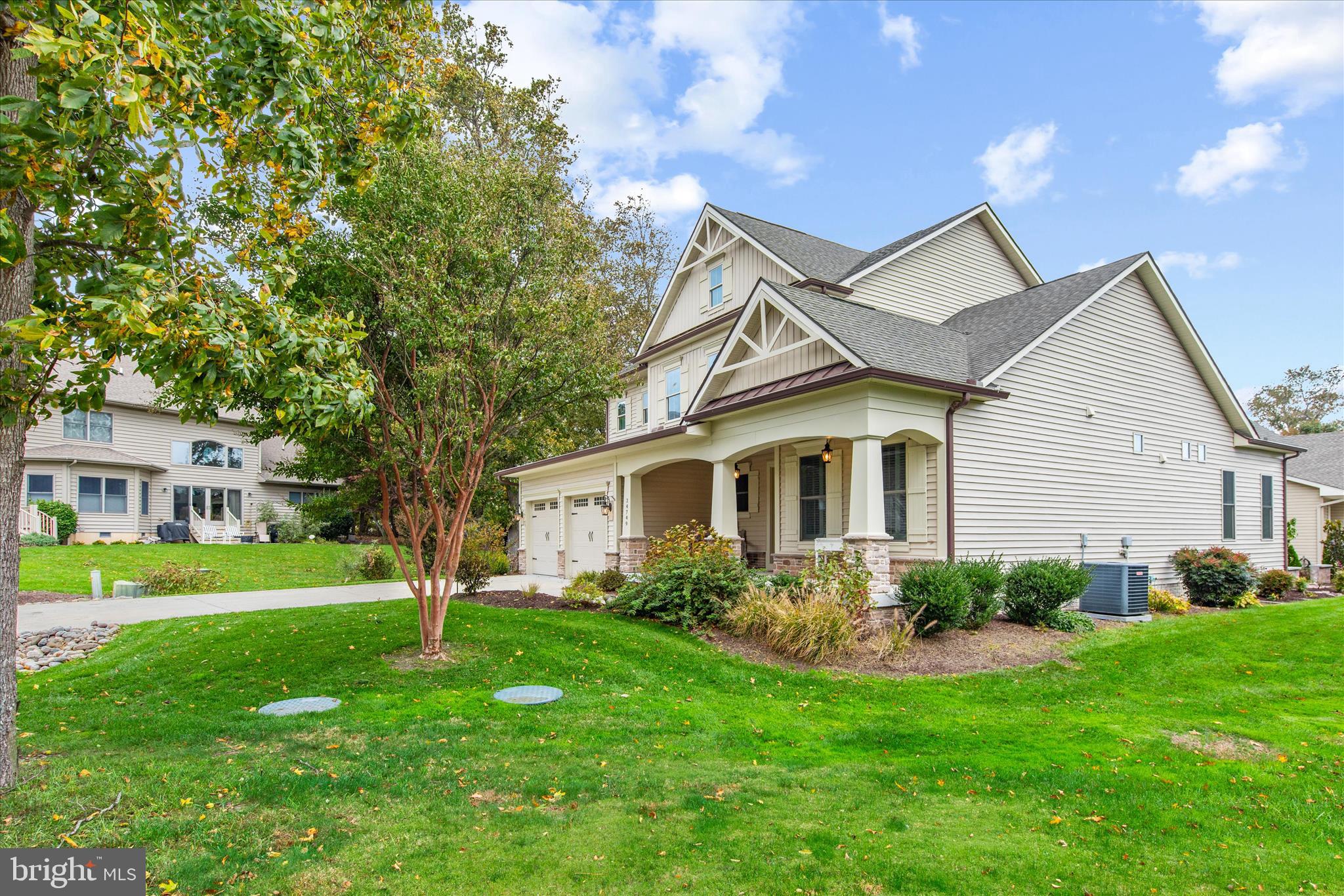 34749 Timber Court Dagsboro, DE 19939 - Photo 45 of 60 a front view of a house with a garden and trees