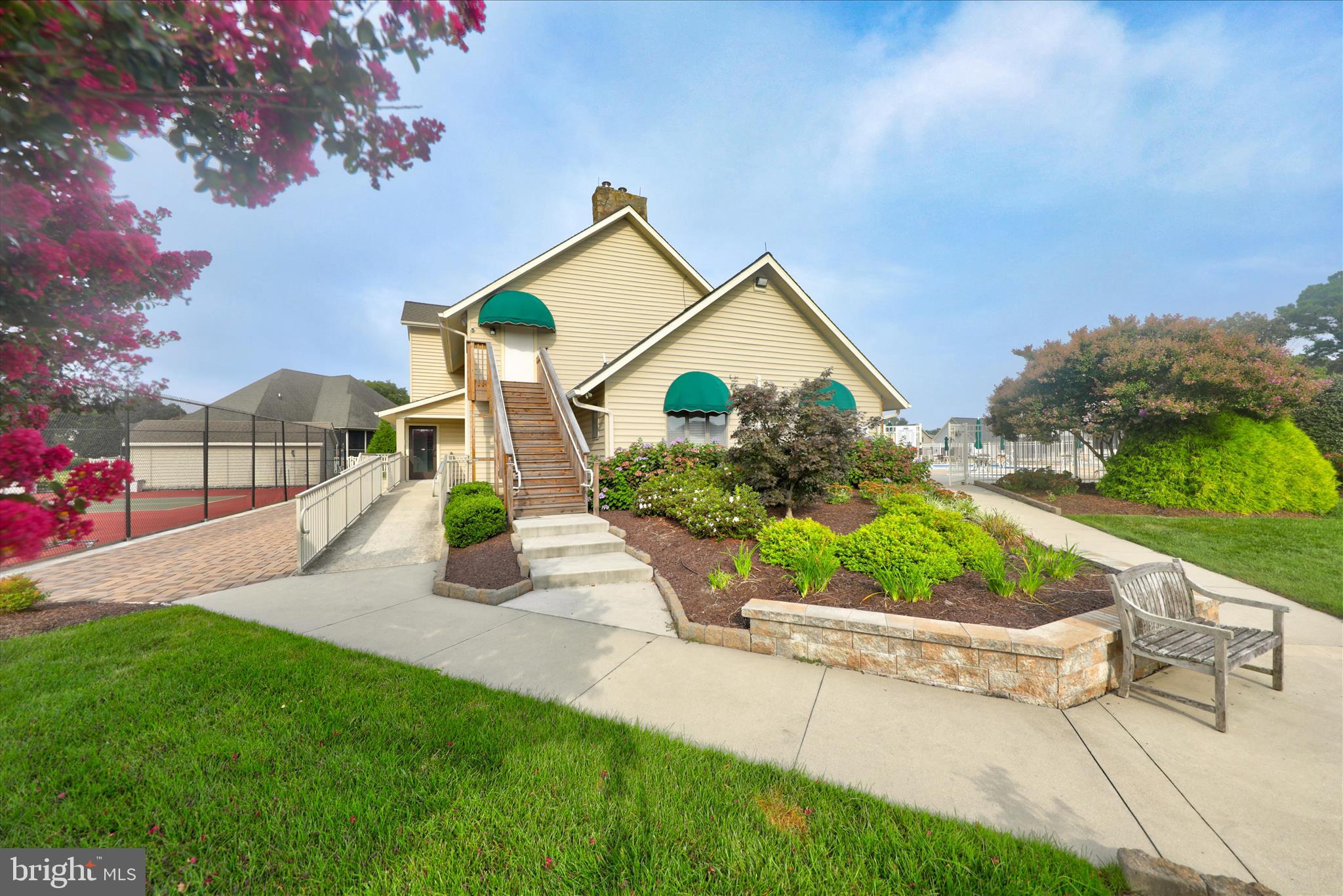 34749 Timber Court Dagsboro, DE 19939 - Photo 58 of 60 a front view of a house with a yard and potted plants