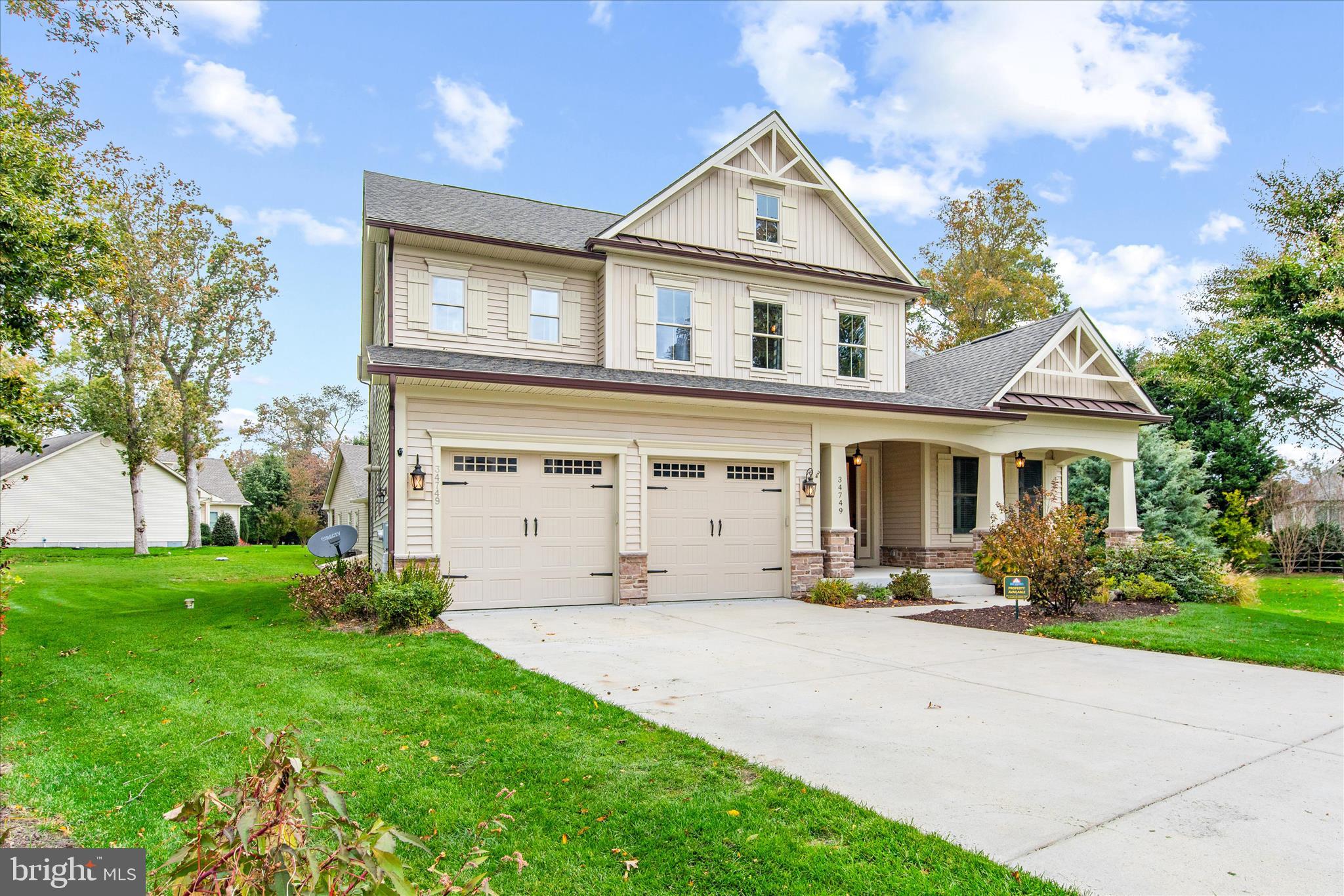 34749 Timber Court Dagsboro, DE 19939 - Photo 6 of 60 a front view of a house with a yard and trees