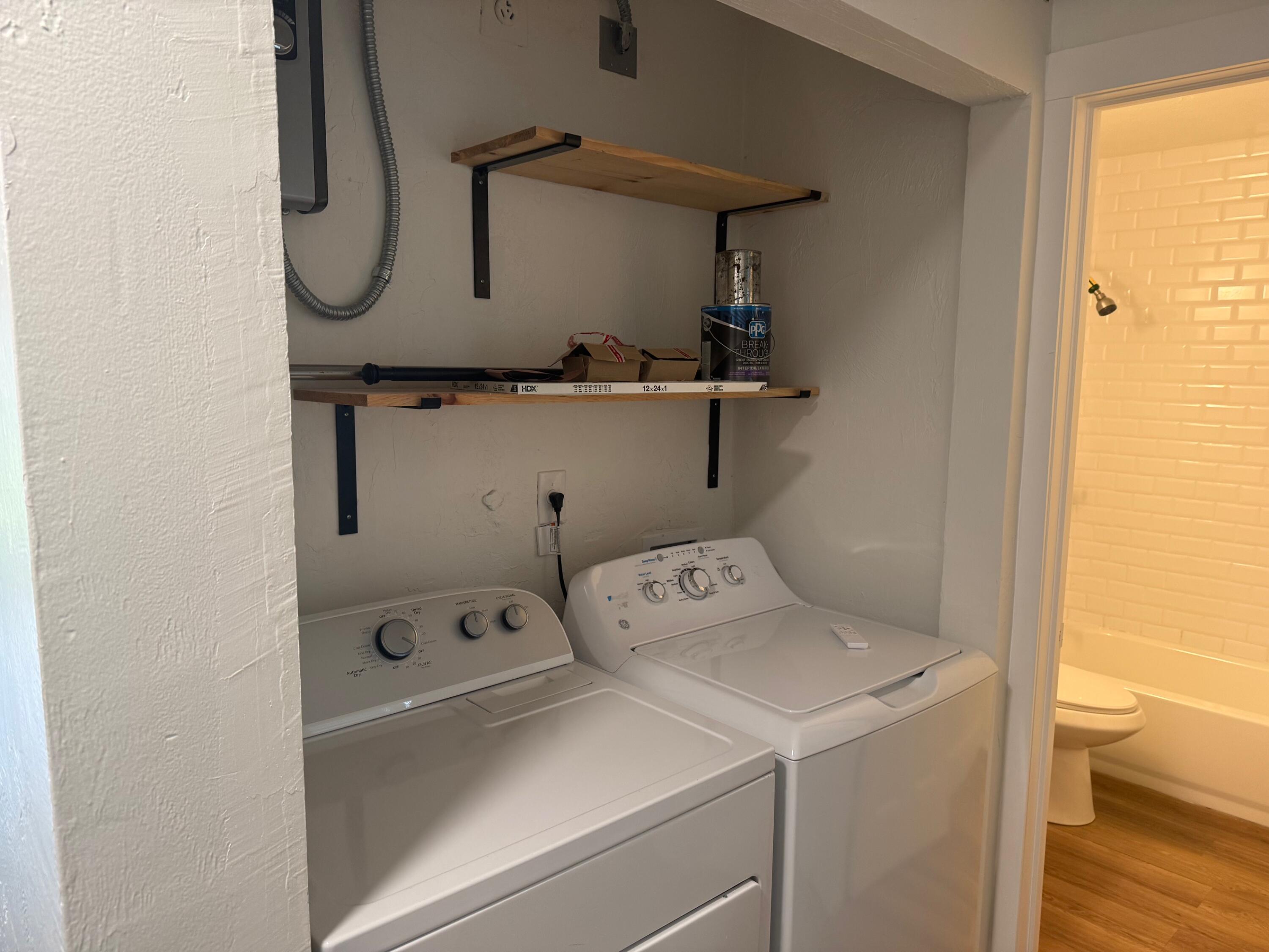 6257 Kendrick Street, Unit 2 Jupiter, FL 33458 - Photo 9 of 11 a utility room with dryer and washer