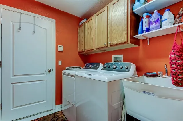 a view of a house with a yard and tree s