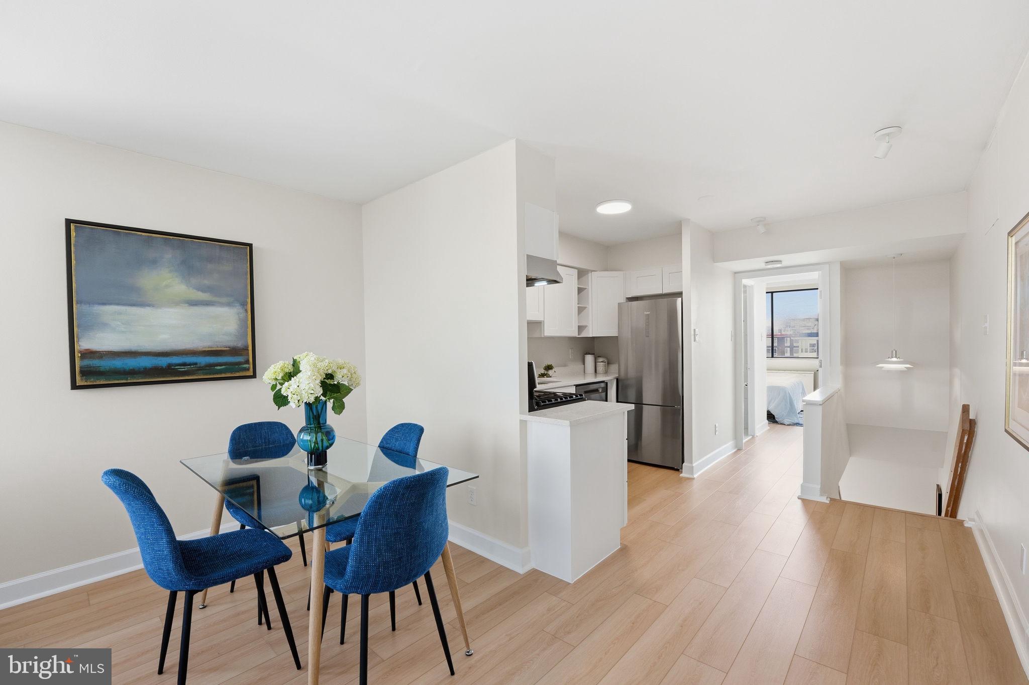 1245 13th Street Northwest, Unit 901 Washington, DC 20005 - Photo 25 of 38 a dining room with furniture and wooden floor