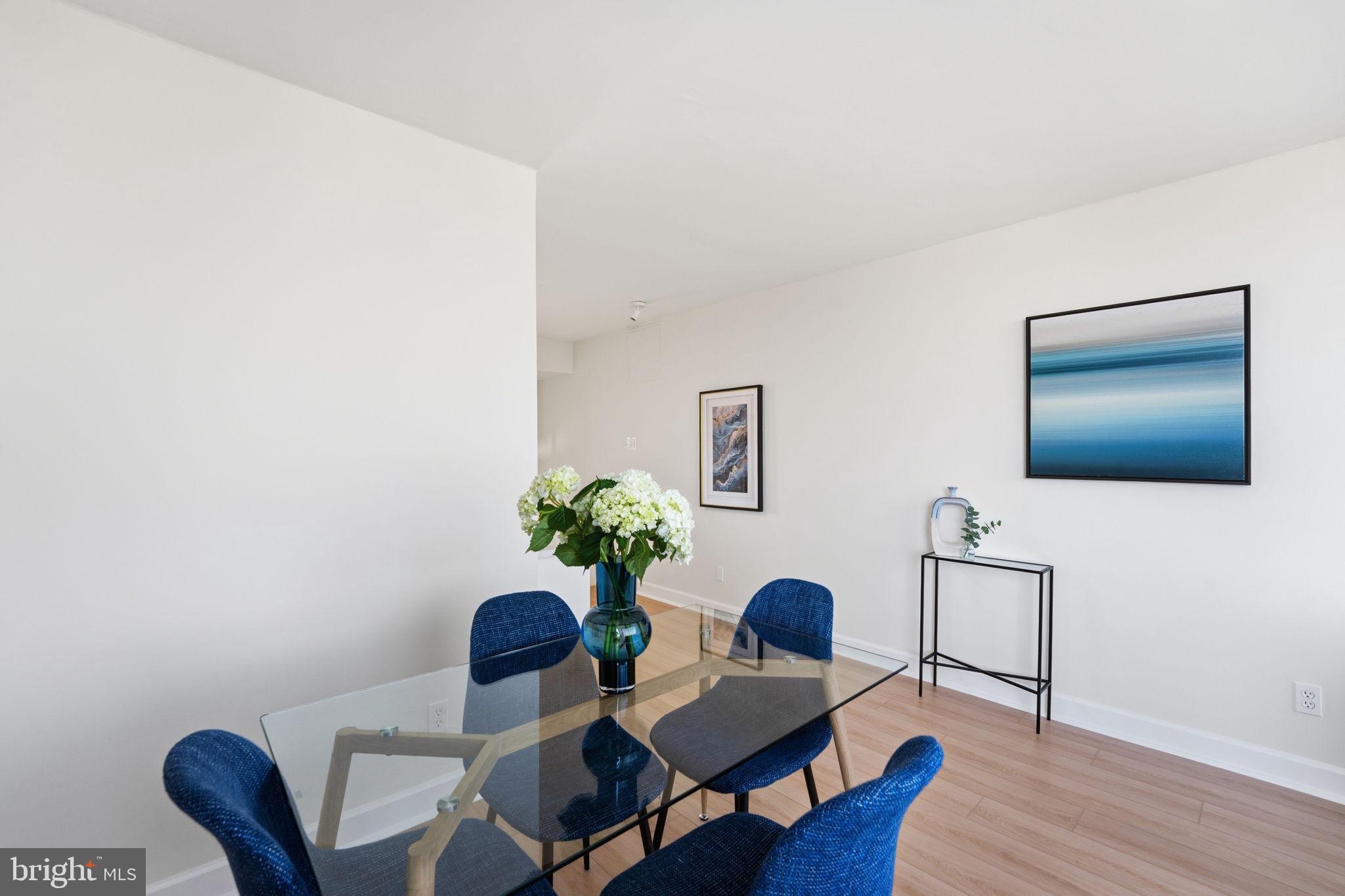 1245 13th Street Northwest, Unit 901 Washington, DC 20005 - Photo 26 of 38 a living room with furniture and a potted plant