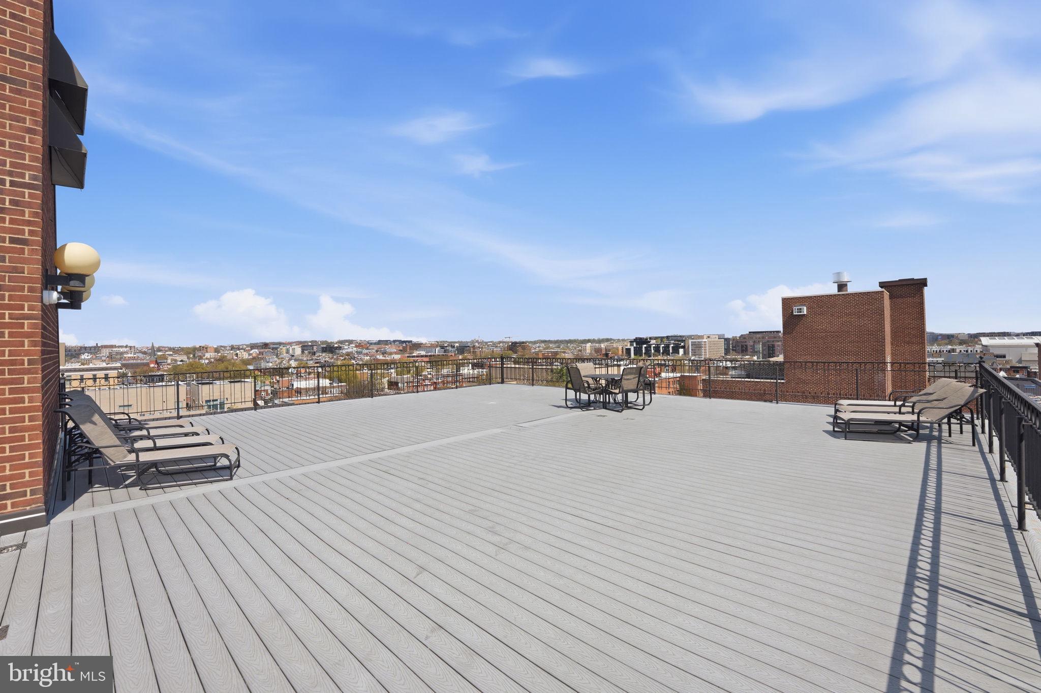 1245 13th Street Northwest, Unit 901 Washington, DC 20005 - Photo 33 of 38 a view of a terrace with lawn chairs