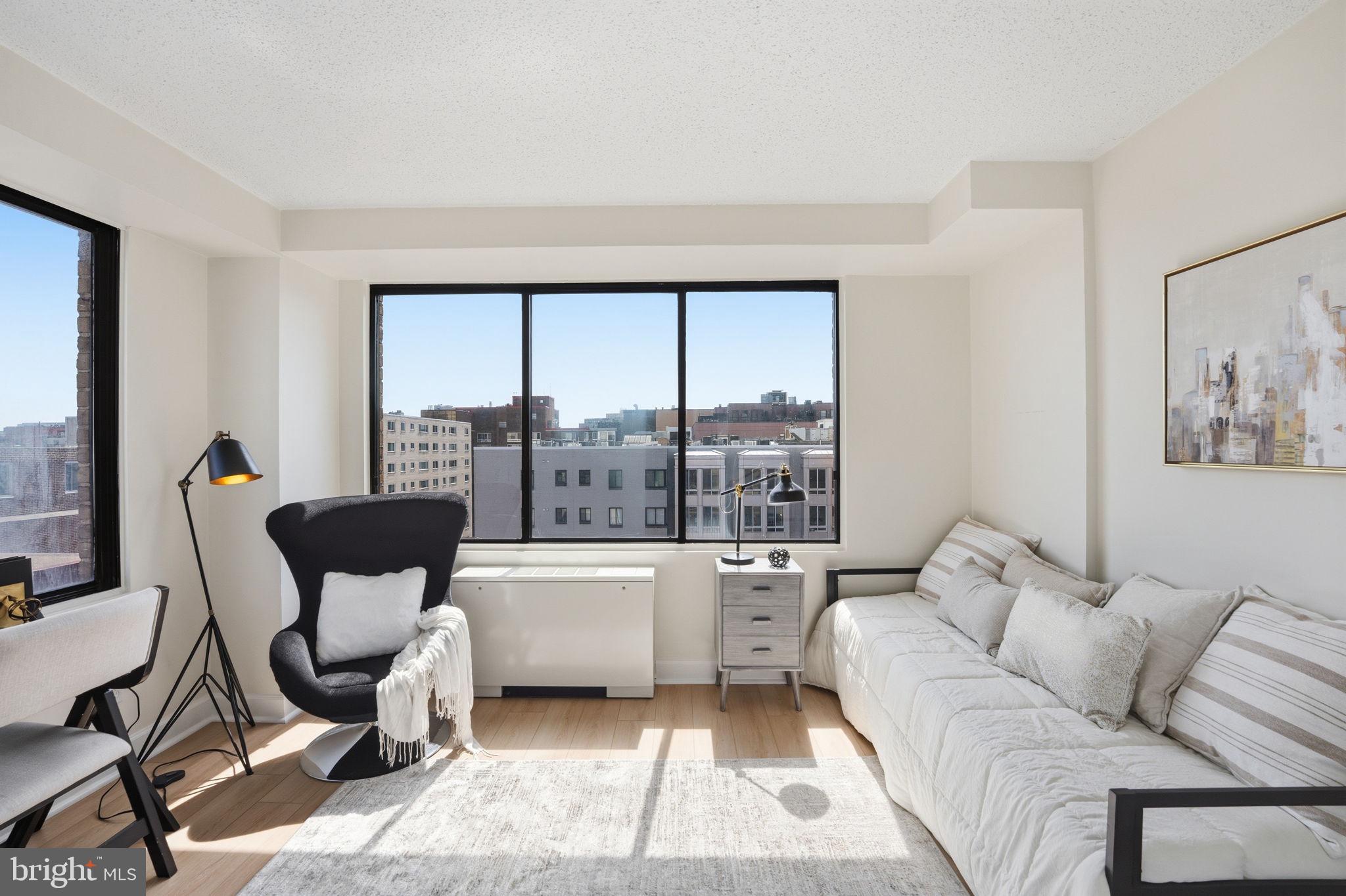 1245 13th Street Northwest, Unit 901 Washington, DC 20005 - Photo 4 of 38 a living room with furniture and a large window