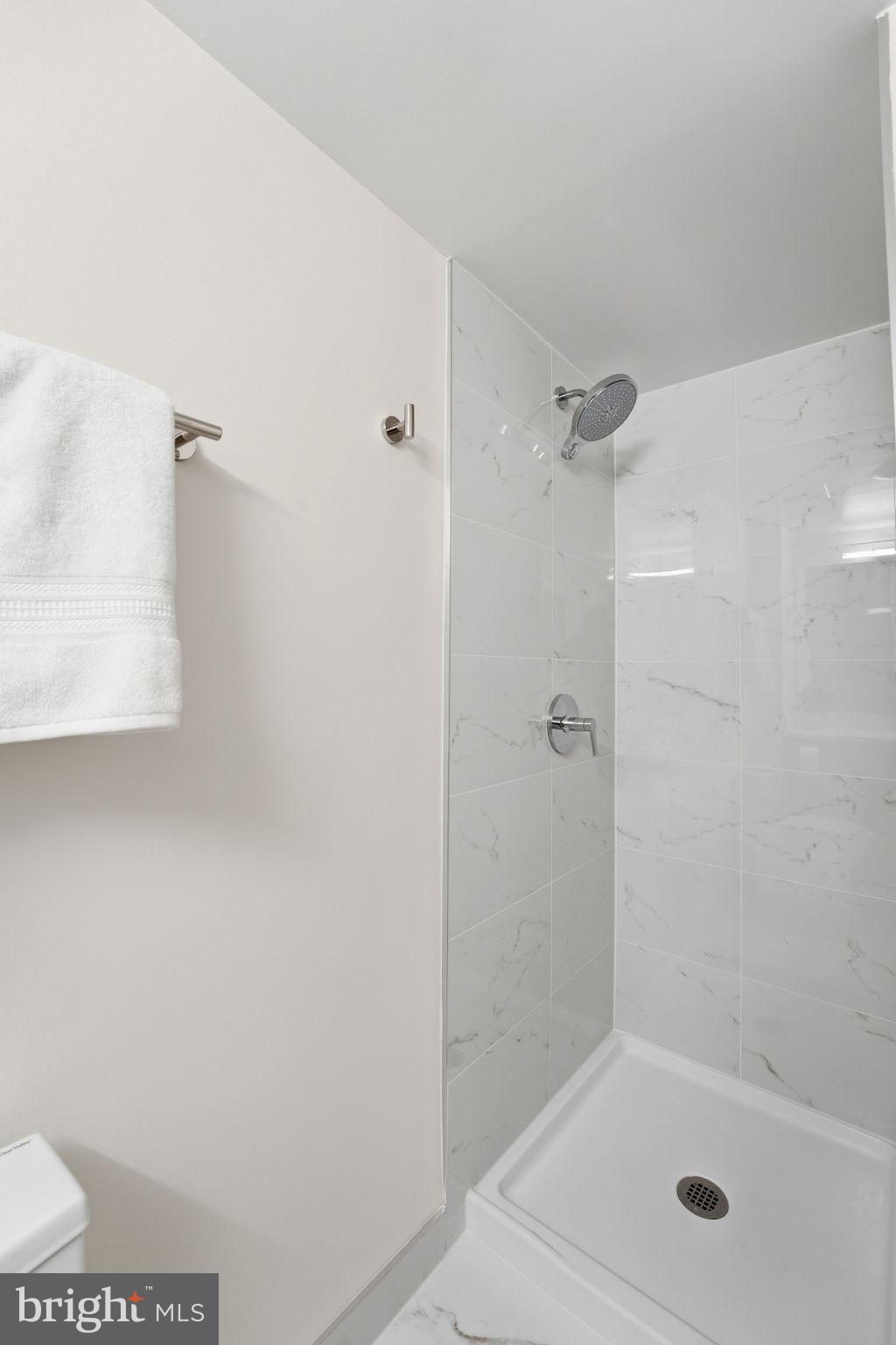 1245 13th Street Northwest, Unit 901 Washington, DC 20005 - Photo 8 of 38 a bathroom with a shower
