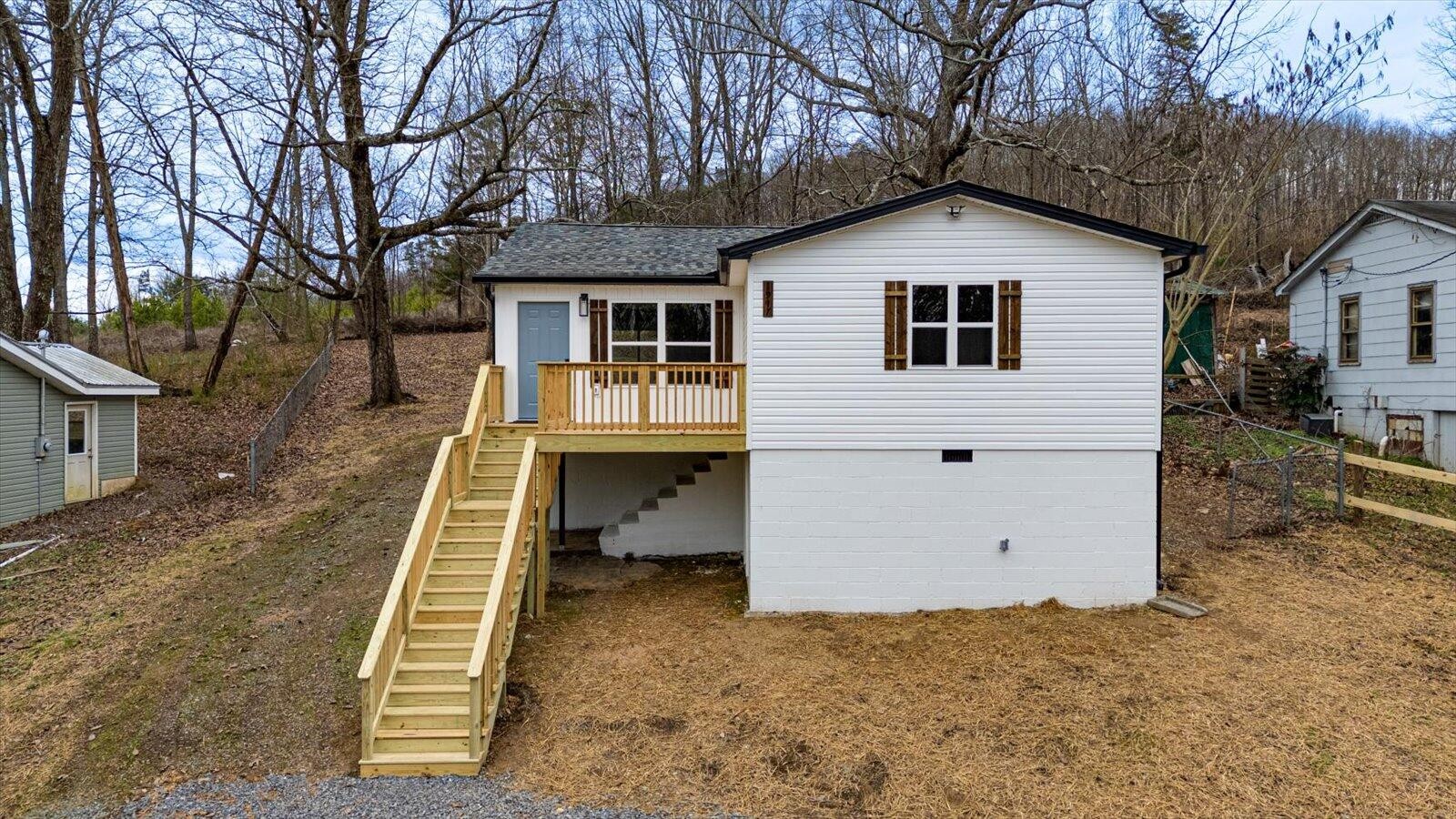a view of a backyard with a large tree