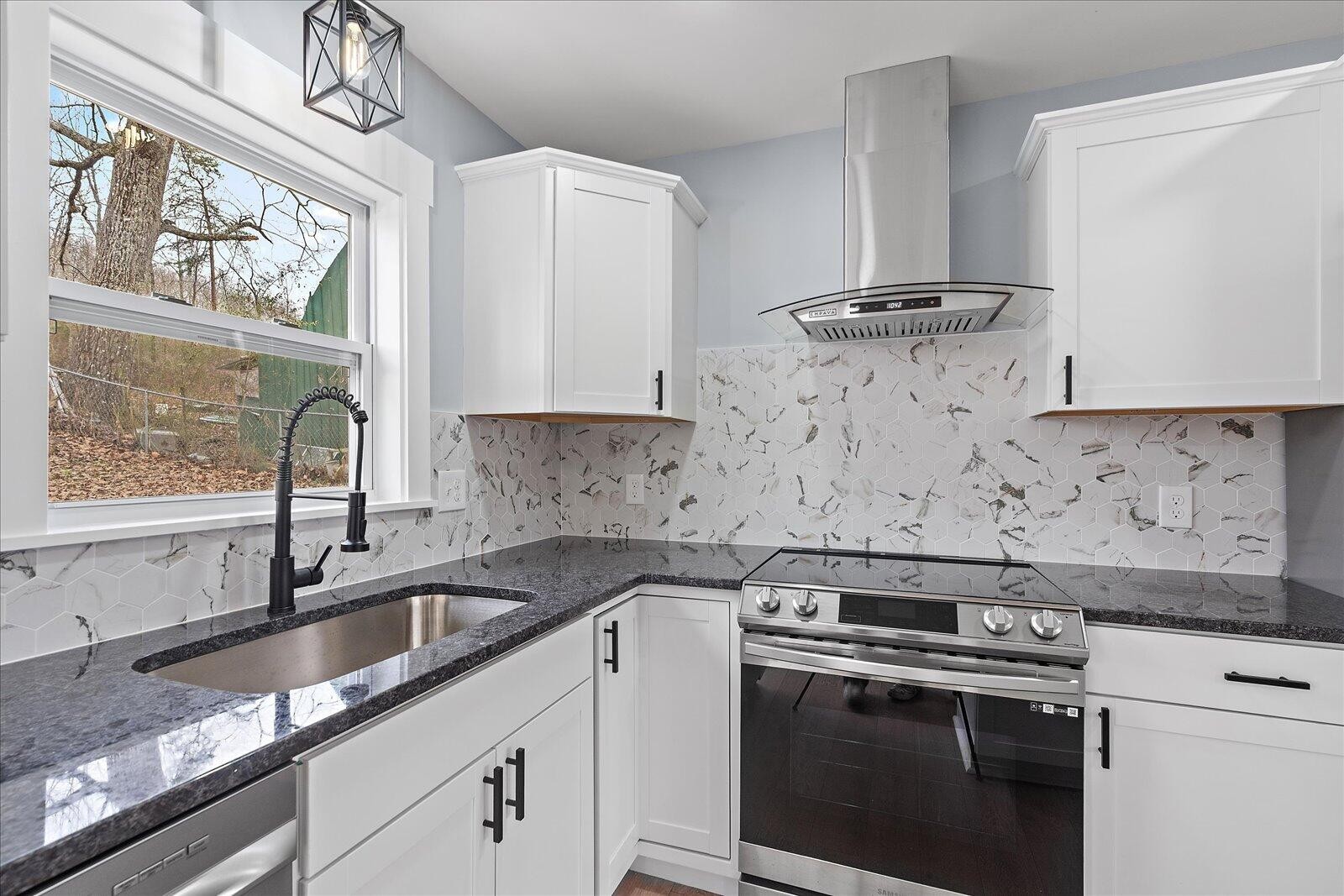 1917 Cir Drive Southwest Cleveland, TN 37311 - Photo 11 of 25 a kitchen with stainless steel appliances a stove a sink a stove and a window