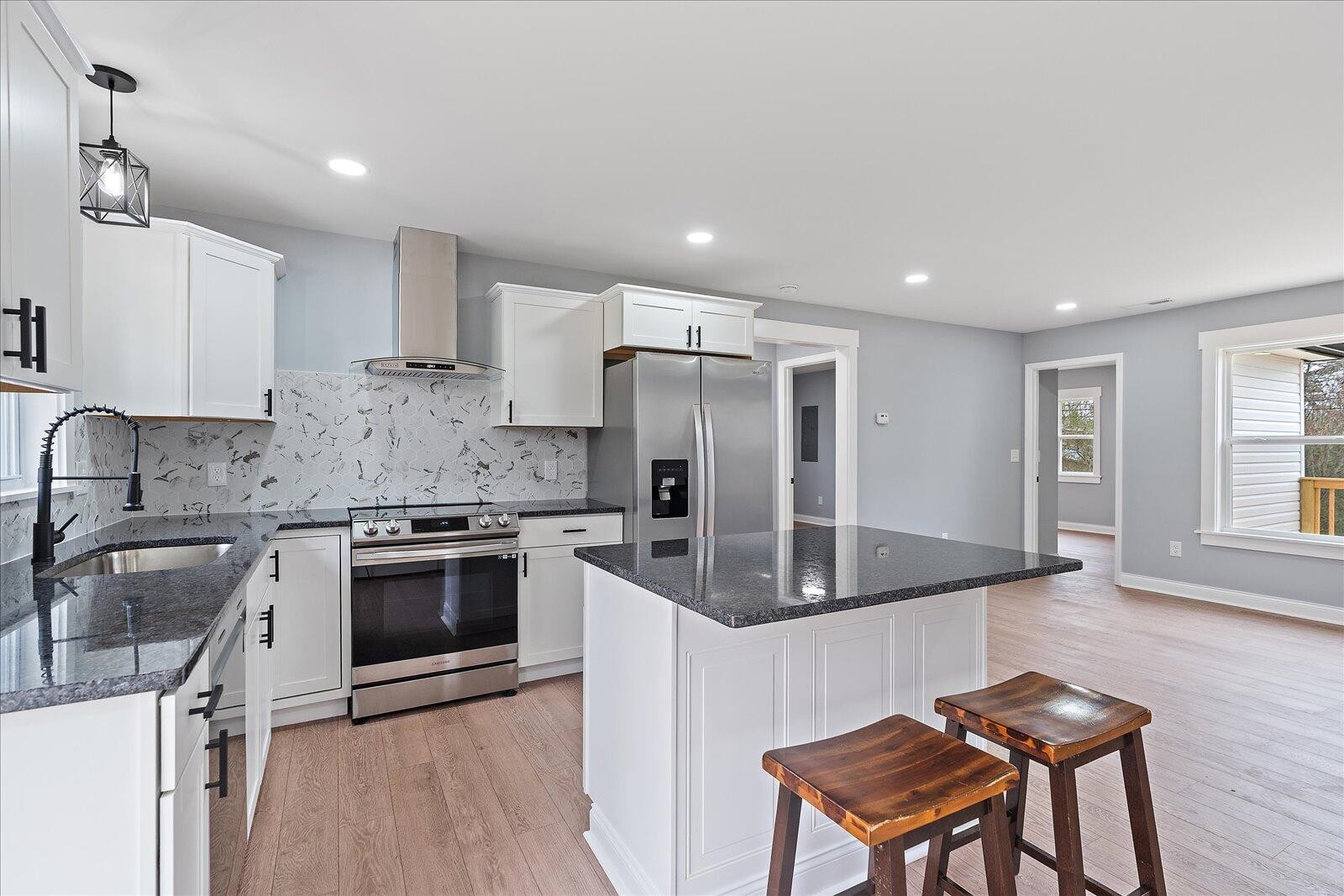 1917 Cir Drive Southwest Cleveland, TN 37311 - Photo 12 of 25 a kitchen with stainless steel appliances granite countertop a sink stove and refrigerator