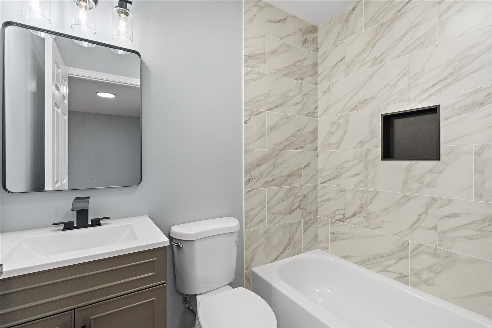 1917 Cir Drive Southwest Cleveland, TN 37311 - Photo 16 of 25 a bathroom with a toilet a sink and bathtub