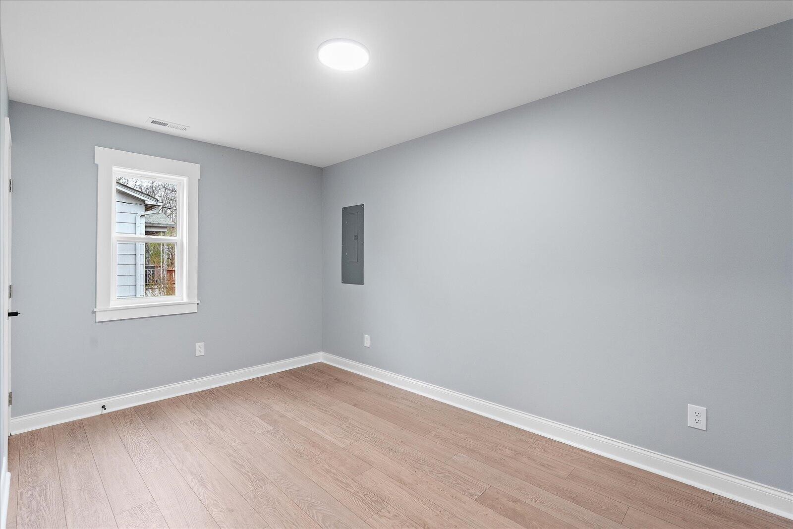 1917 Cir Drive Southwest Cleveland, TN 37311 - Photo 17 of 25 wooden floor in an empty room with a window
