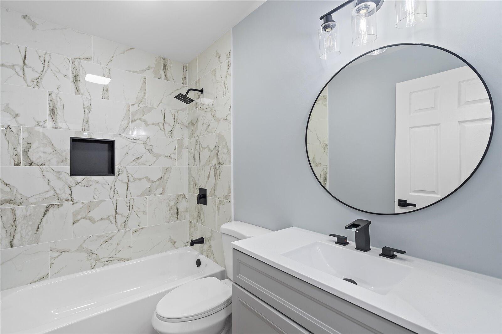 1917 Cir Drive Southwest Cleveland, TN 37311 - Photo 18 of 25 a bathroom with a sink a toilet and a mirror