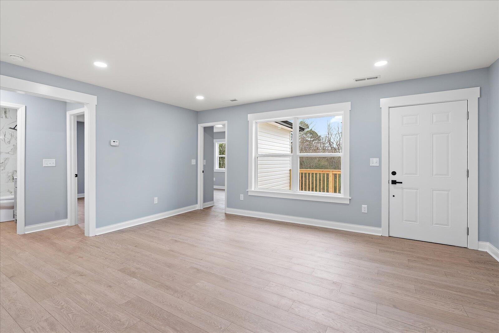 1917 Cir Drive Southwest Cleveland, TN 37311 - Photo 5 of 25 an empty room with wooden floor and windows