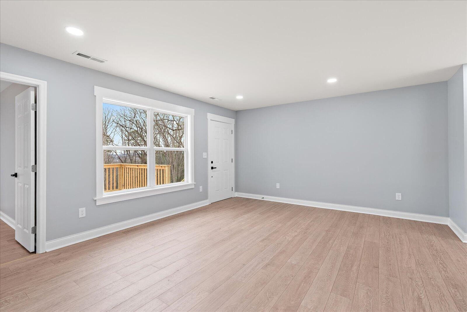 1917 Cir Drive Southwest Cleveland, TN 37311 - Photo 6 of 25 an empty room with wooden floor and windows