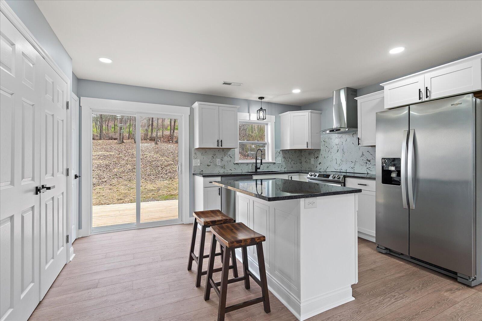 1917 Cir Drive Southwest Cleveland, TN 37311 - Photo 8 of 25 a kitchen with stainless steel appliances granite countertop a refrigerator a sink and white cabinets