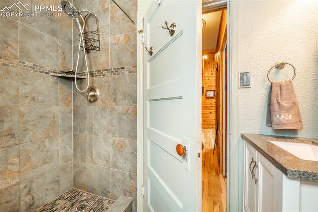 9050 Picabo Road Cascade, CO 80809 - Photo 19 of 40 Main house bathroom with upgraded tiled shower