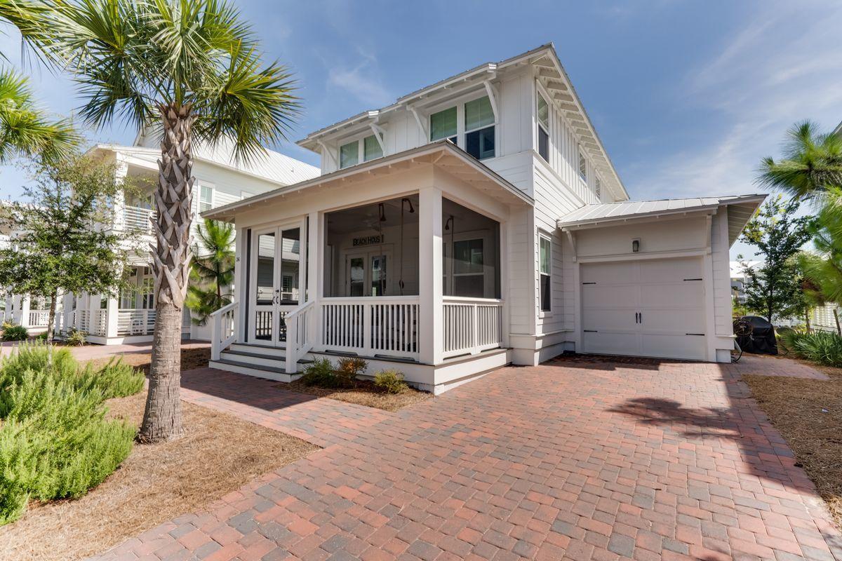36 Clipper Street Inlet Beach, FL 32461 - Photo 3 of 44 a front view of a house with a garden
