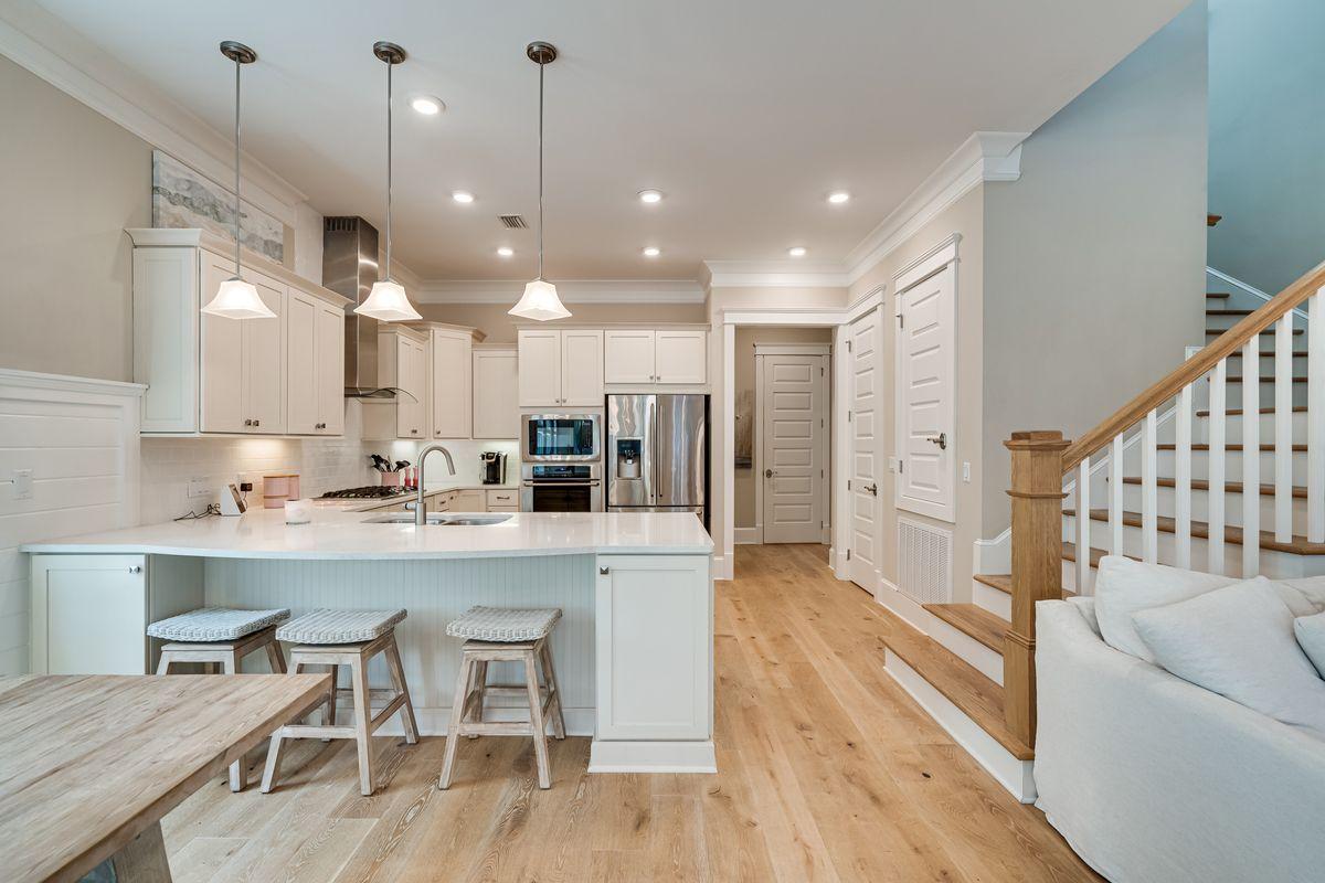 36 Clipper Street Inlet Beach, FL 32461 - Photo 5 of 44 a large white kitchen with lots of counter space and refrigerator