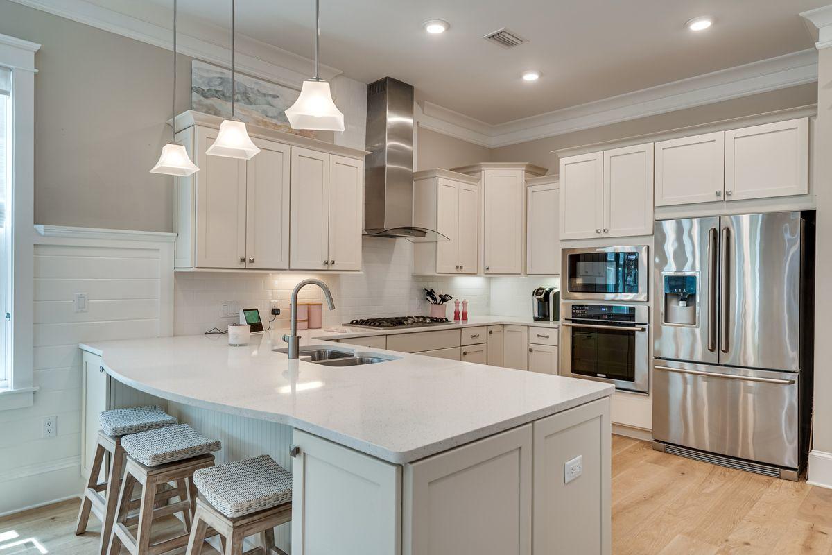 36 Clipper Street Inlet Beach, FL 32461 - Photo 6 of 44 a kitchen with cabinets a center island stainless steel appliances and cabinets