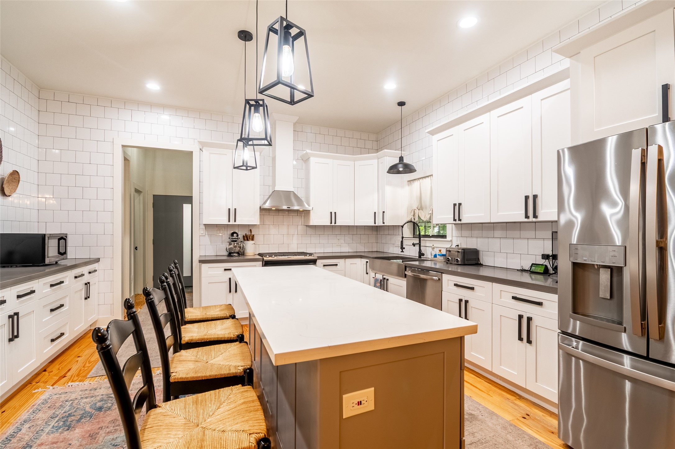 200 Carl Street Houston, TX 77009 - Photo 8 of 32 a kitchen that has a lot of cabinets in it and appliances