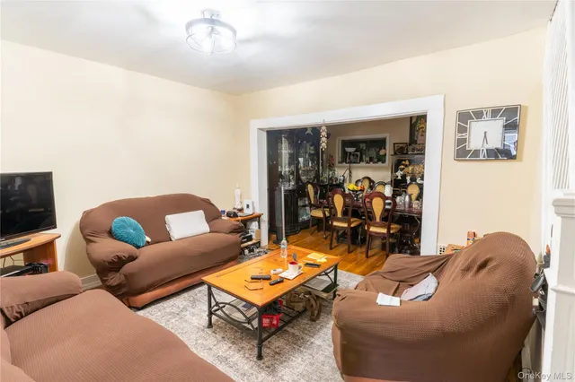 a view of a dining room with furniture and a chandelier