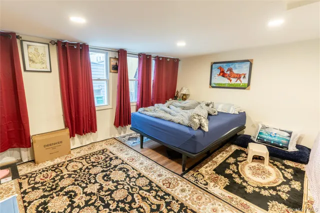 a bathroom with a sink mirror and toilet