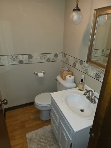 a living room with furniture window and wooden floor