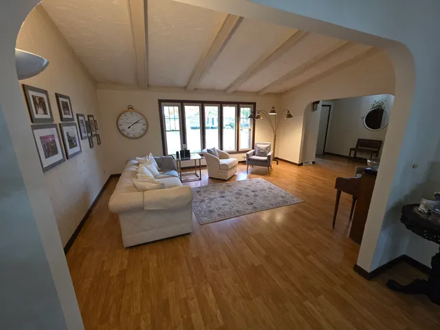 a bedroom with a bed and a mirror