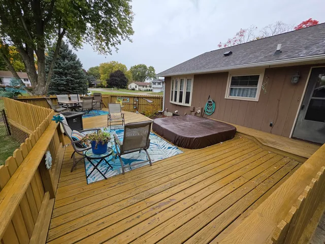 swimming pool view with a seating space
