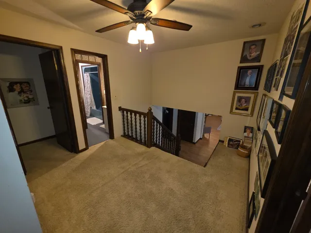 a bedroom with a bed and a night stand