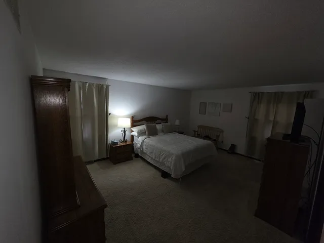 a bathroom with a sink a mirror and a shower