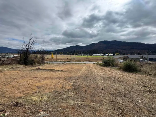 a view of a lake with houses in the back