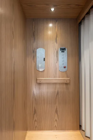 a view of an empty room and wooden floor