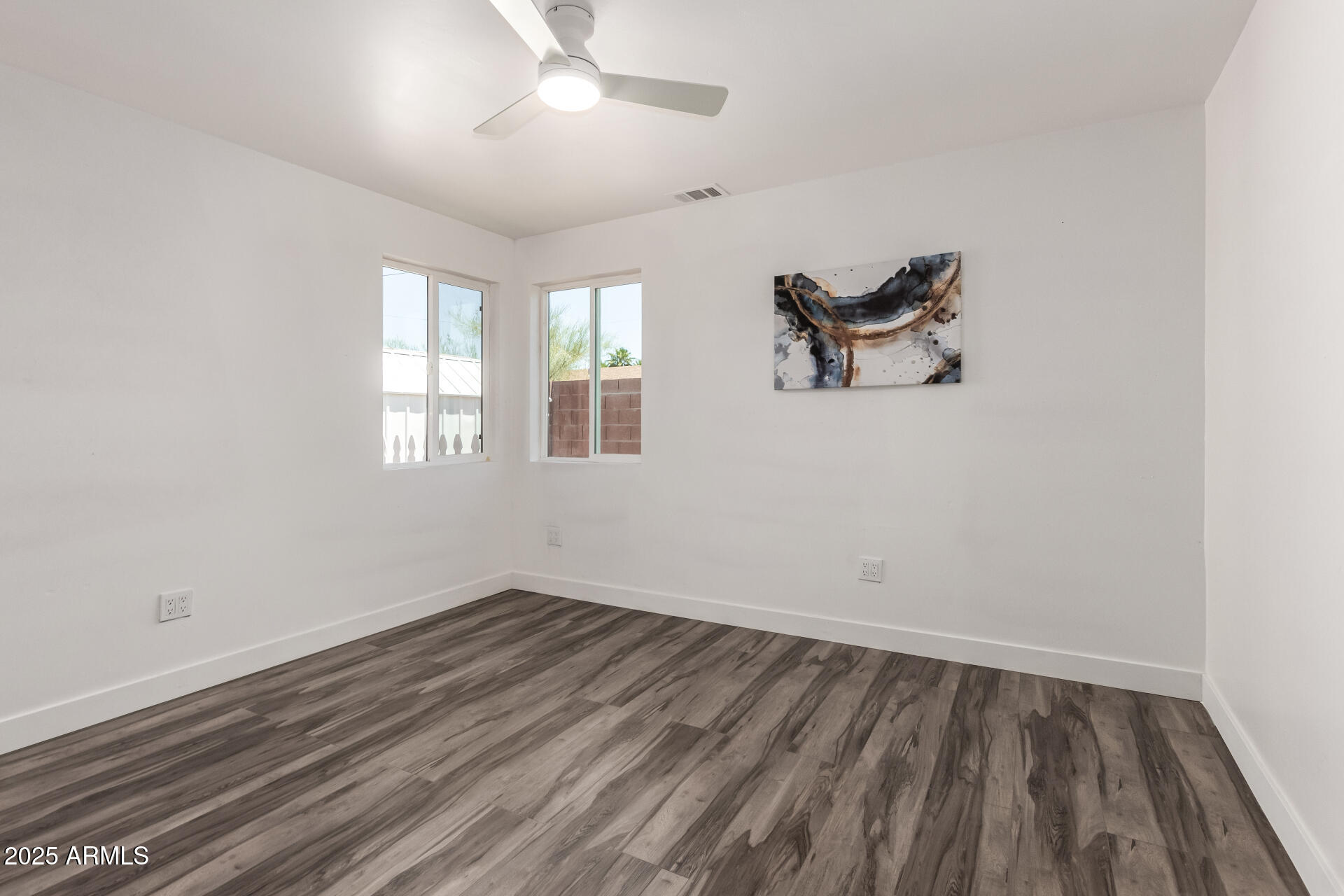39 North Maple Mesa, AZ 85205 - Photo 15 of 29 wooden floor in an empty room with a window