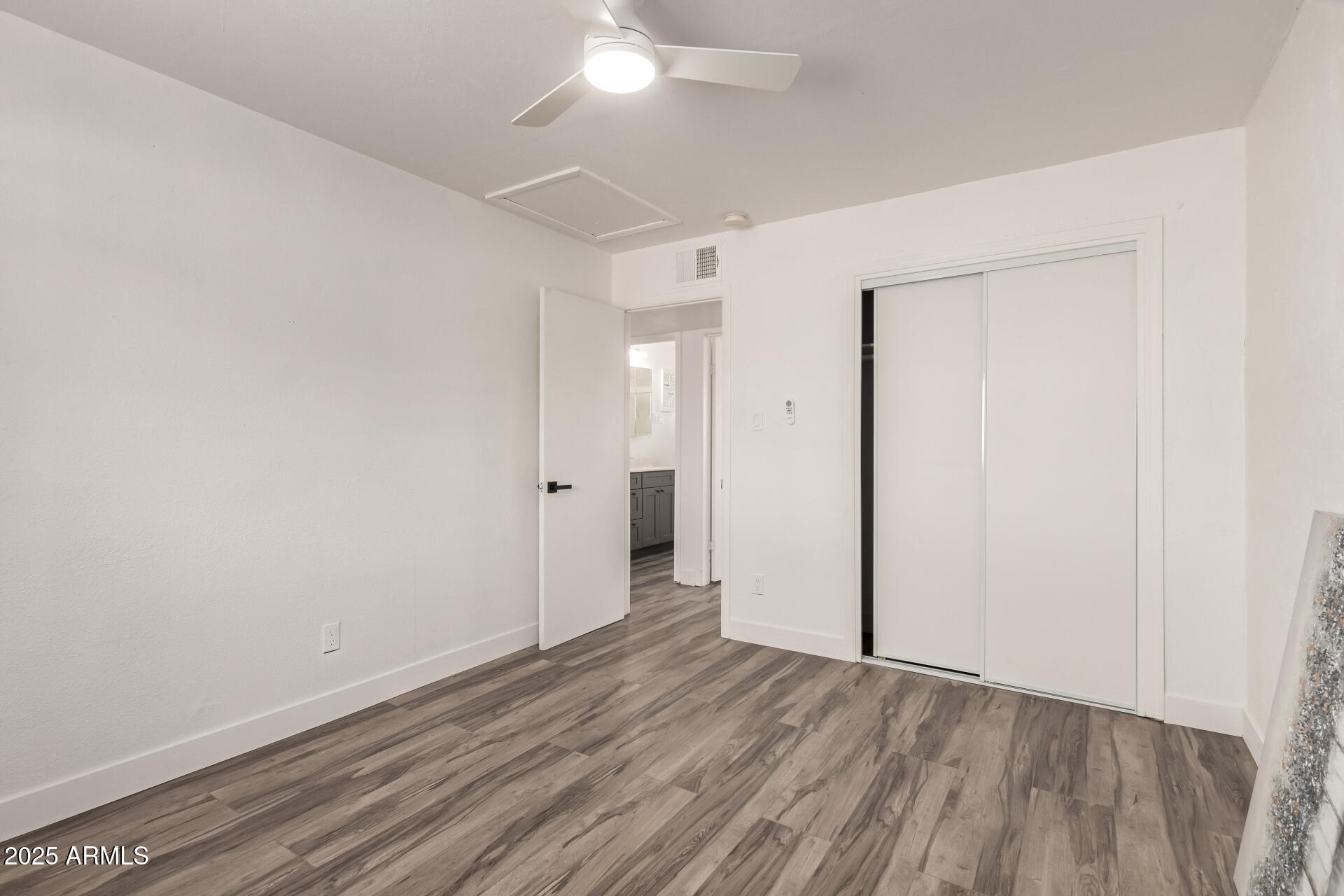39 North Maple Mesa, AZ 85205 - Photo 20 of 29 an empty room with wooden floor and windows