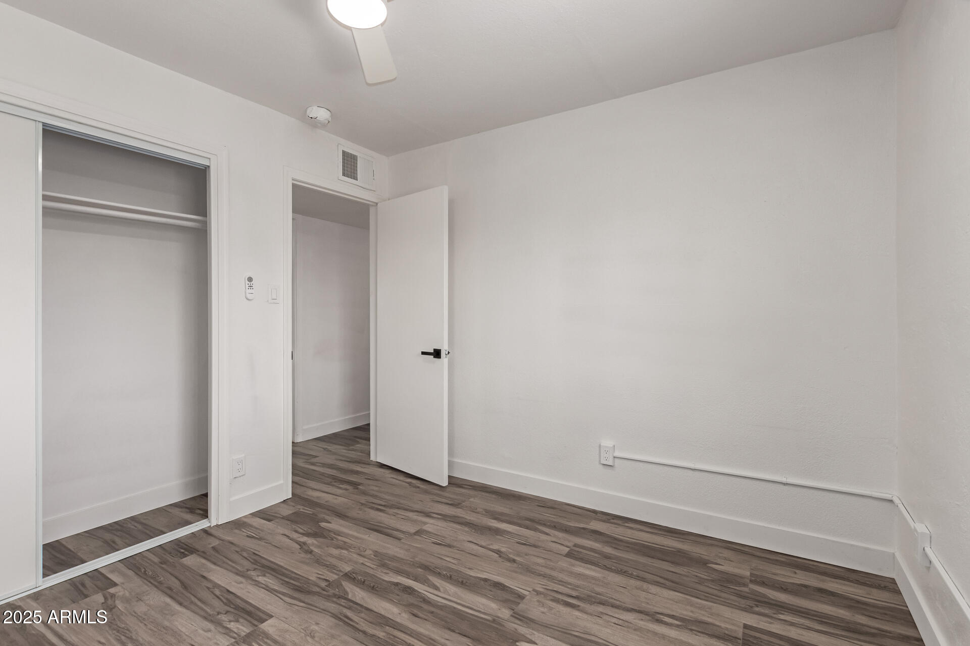 39 North Maple Mesa, AZ 85205 - Photo 22 of 29 a view of an empty room with wooden floor