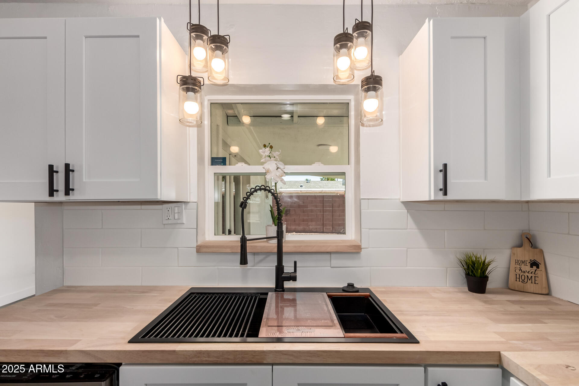 39 North Maple Mesa, AZ 85205 - Photo 3 of 29 a kitchen with kitchen island a counter top space a stove and cabinets
