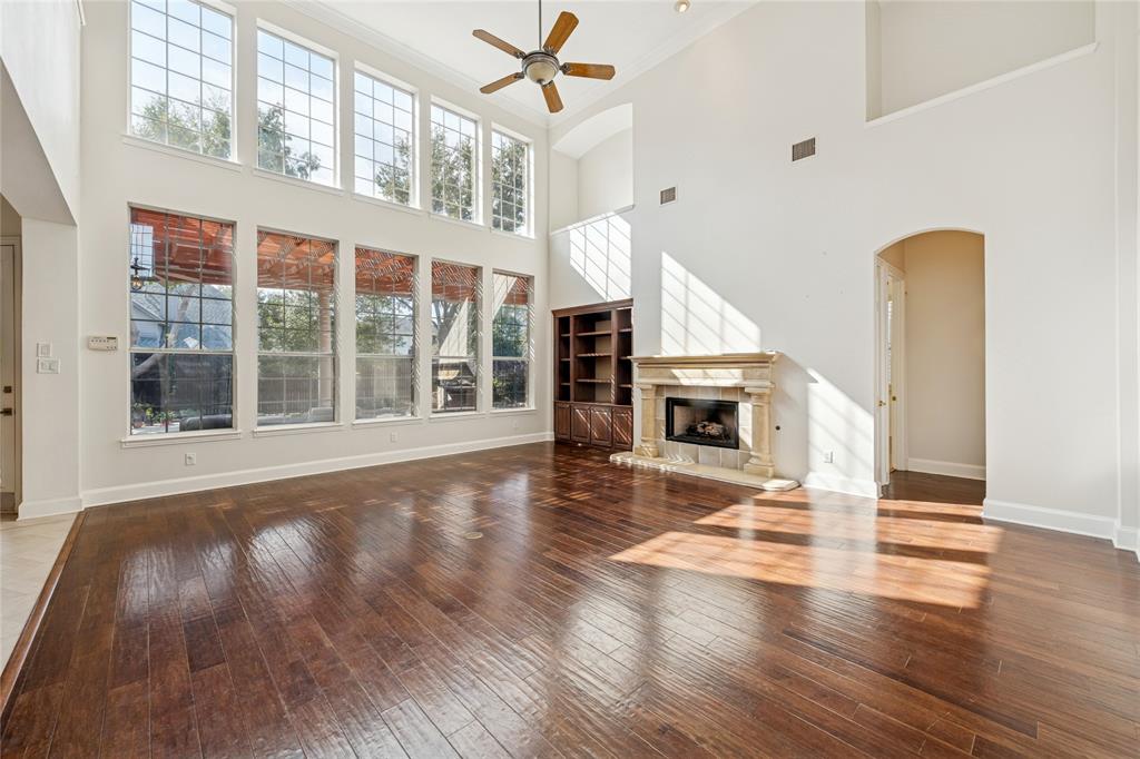 2107 Spindletop Trail Frisco, TX 75033 - Photo 12 of 39 a view of an entryway with wooden floor fireplace and a window