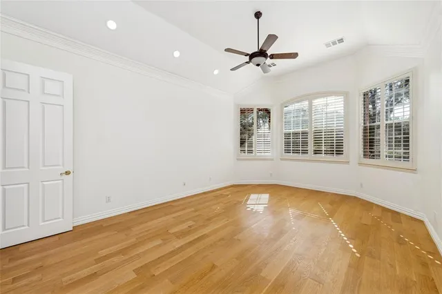 a bathroom with a granite countertop sink a toilet and a large mirror