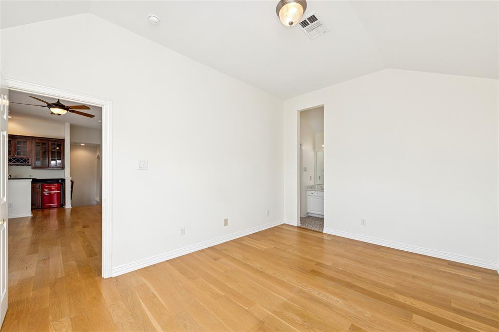 2107 Spindletop Trail Frisco, TX 75033 - Photo 27 of 39 an empty room with wooden floor and closet