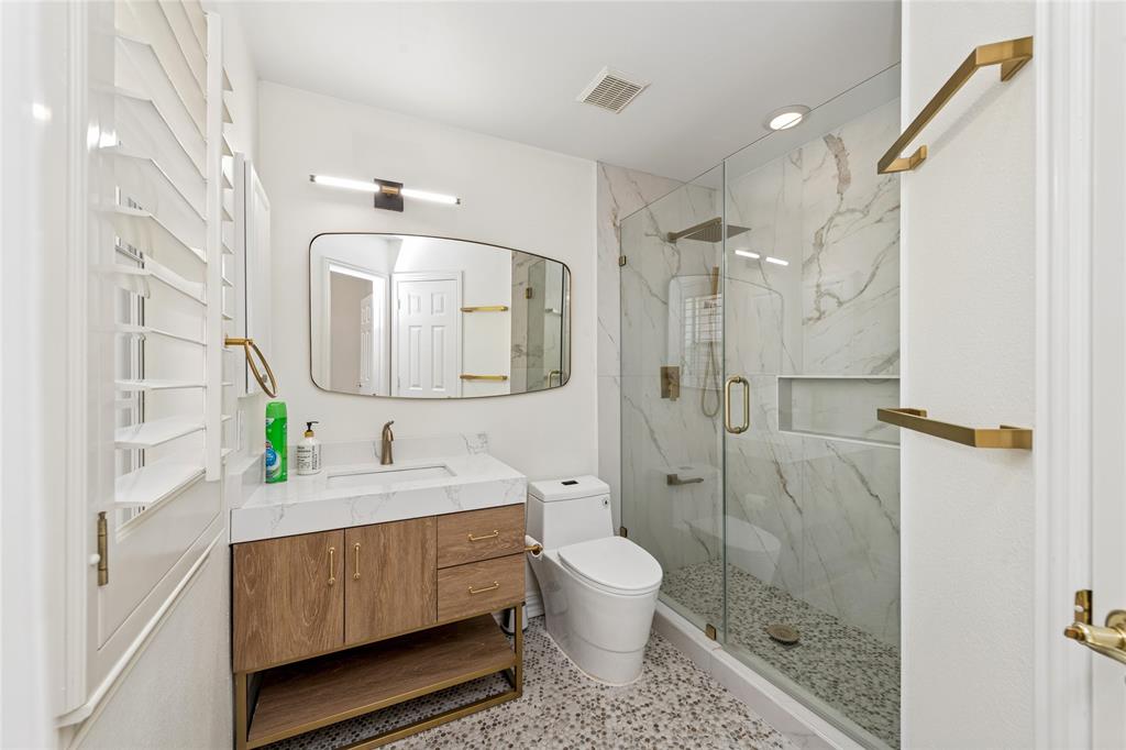2107 Spindletop Trail Frisco, TX 75033 - Photo 29 of 39 a bathroom with a sink a toilet and shower