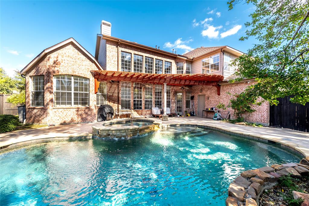 2107 Spindletop Trail Frisco, TX 75033 - Photo 38 of 39 a front view of a house with swimming pool having outdoor seating
