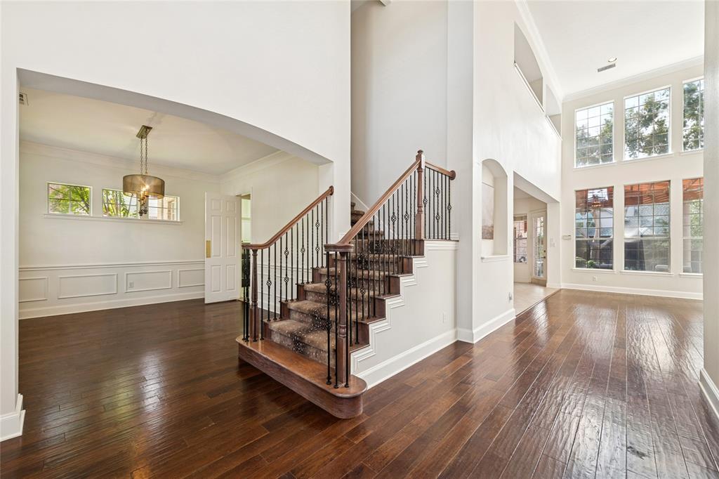 2107 Spindletop Trail Frisco, TX 75033 - Photo 5 of 39 a view of entryway with wooden floor and stairs