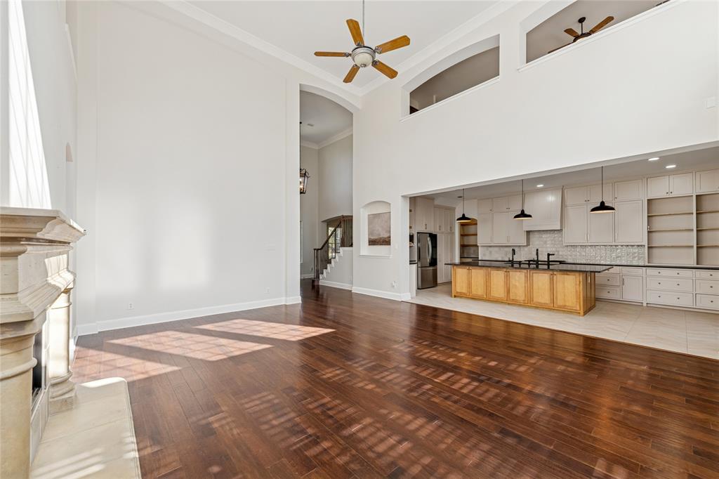2107 Spindletop Trail Frisco, TX 75033 - Photo 8 of 39 a view of an empty room with kitchen view and a window