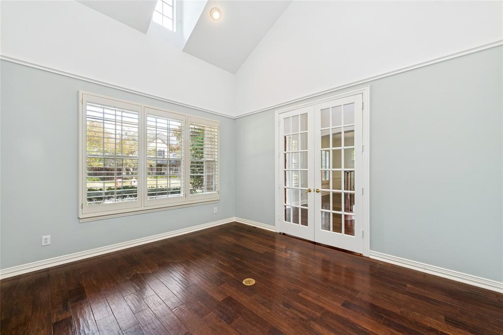 2107 Spindletop Trail Frisco, TX 75033 - Photo 9 of 39 an empty room with wooden floor and windows