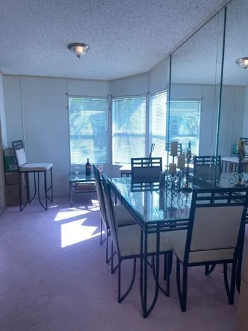 a kitchen with a table and chairs