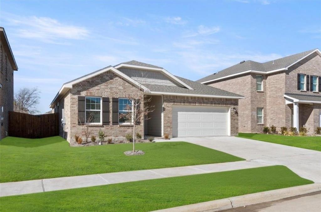 10308 Holy Cross Lane Crowley, TX 76036 - Photo 27 of 27 a front view of a house with garden